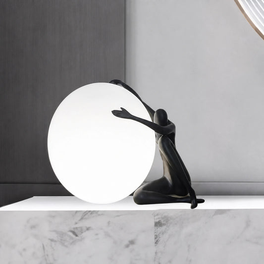 F9184 Black Seated Figure Pushing Globe Sculptural Table Lamp